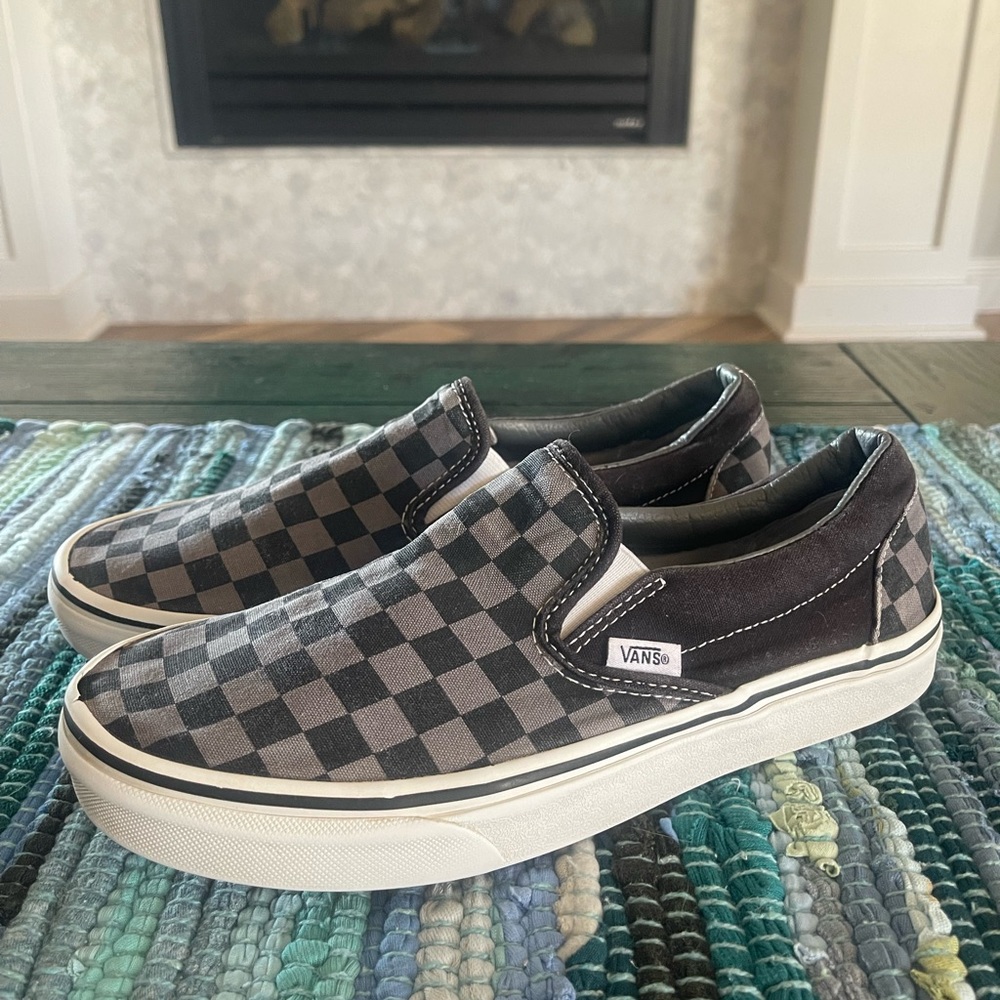 Black and grey checkered slip-on Vans